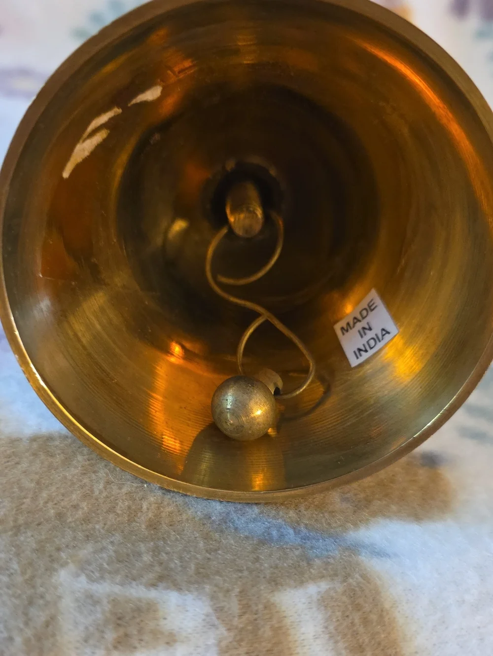 vintage brass bell featuring enameled holly leaves and berries